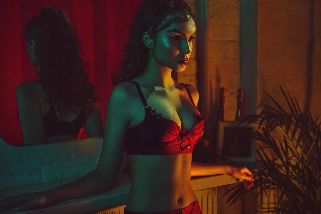 Jake Hicks Photography - woman in red lingere under coloured lights